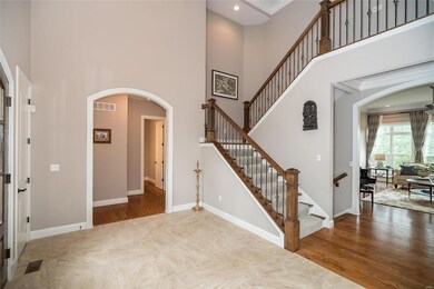 Master bedroom suite and a second room with private bath are through this archway.