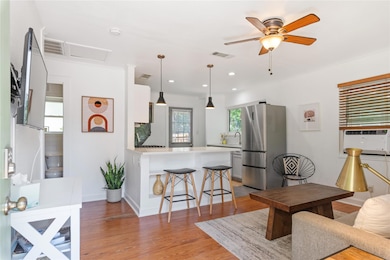Living room featuring light wood-style flooring, 