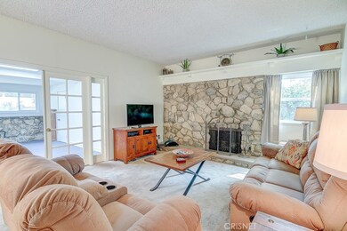 Living room with stone fireplace
