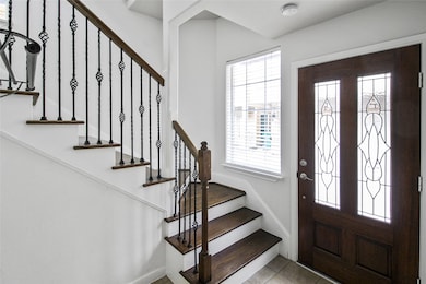 Bright and inviting entryway with an open layout.