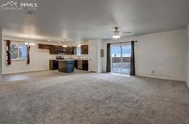 Unfurnished living room with light colored carpet,