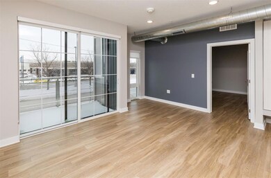 A sliding door leads to the balcony