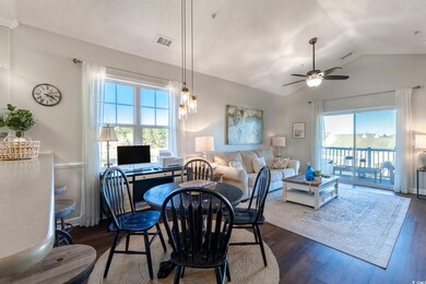 Dining space featuring lofted ceiling, a healthy a