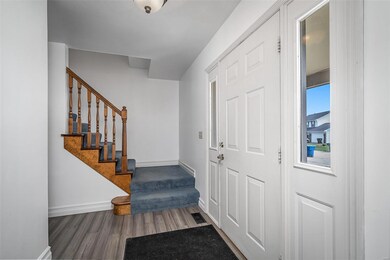 Entry foyer with staircase leading to 2nd floor
