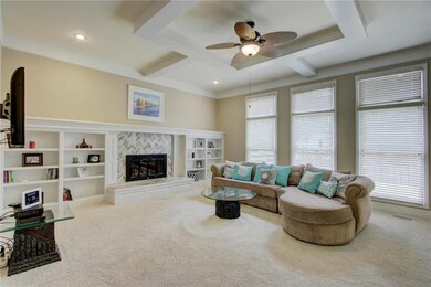 Fireplace is both gas and electric and has seat. T