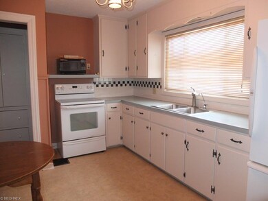 Applianced kitchen with oven, range, refrigerator 