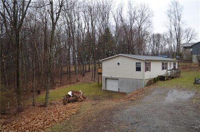 Integral garage and wooded back lot