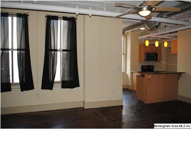 Neutral color walls with sun-filled windows throug