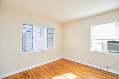 Spare room with baseboards, light wood finished fl
