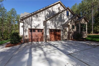 The attached side load two-car garage provides ple