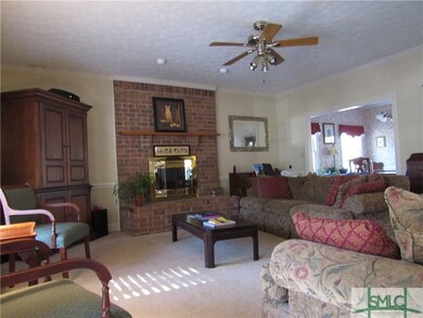 living room with decorative brick fireplace