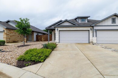 View of front of property with concrete driveway,