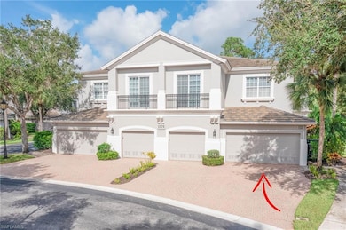 View of front of home with a balcony and a garage