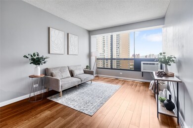 LIVING AREA W/ LARGE WINDOWS TO ENJOY COOL BREEZES