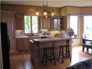Spacious kitchen features a large L-shaped eating 