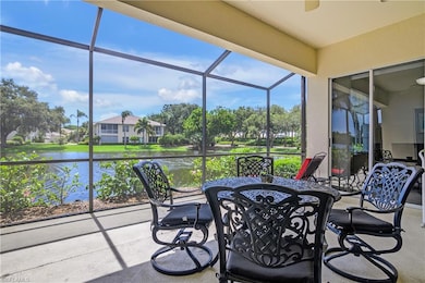 Sunroom / solarium featuring a water view