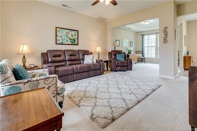 Open floor plan with formal dining or flex space.