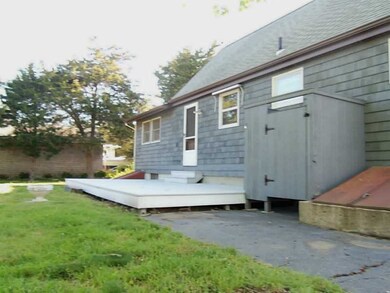 Exterior Back. Out door shower and large deck.