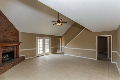 The roomy Great Room boasts neutral colors, tile f