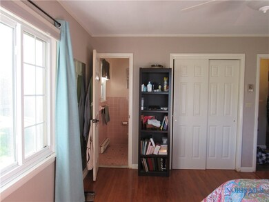 View to masters half bathroom and closet.
