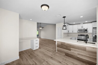 Kitchen with kitchen peninsula, appliances with st