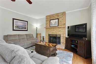 Fireside family room with stacked stone mantle and