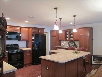 Kitchen. Beautiful wood cabinetry, lots of counter