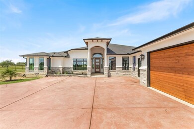 View of front facade featuring stucco siding, sto