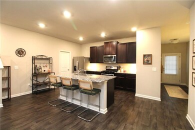 Chef's Kitchen with stainless steel appliances, granite countertops and large island.