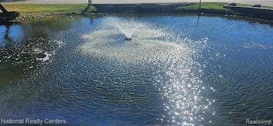 Swimming pool featuring a water view