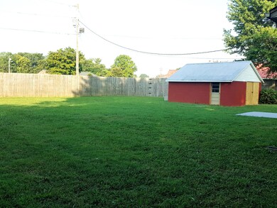 Backyard has a Detached Garage constructed of Concrete Block and has Concrete Flooring.  Backyard is very private with the Privacy Fence.