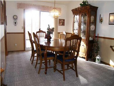 The formal dining offers a sliding glass door to t