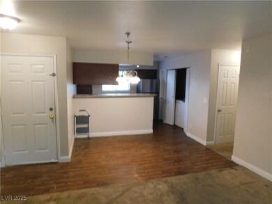 Kitchen with a notable chandelier, pendant lightin