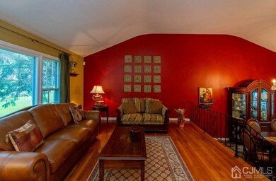 LIVING ROOM FACING THE SUNKEN DINING ROOM