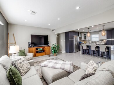 Living room featuring light hardwood / wood-style 