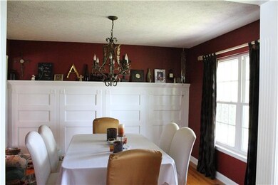Here is the Formal Dining Room with designer color paint and Wainscotting adorning a complete wall