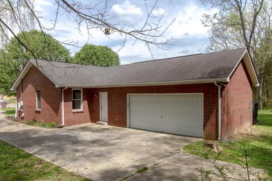 Convenient side garage parking in back.