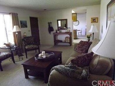 View from fireplace wall toward kitchen and dining