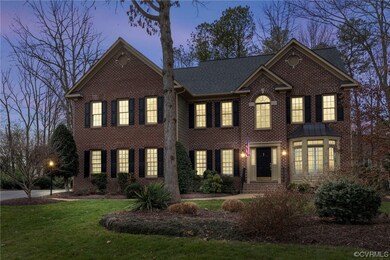 Colonial home featuring a lawn