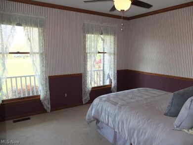 Formal dining room with crown molding.