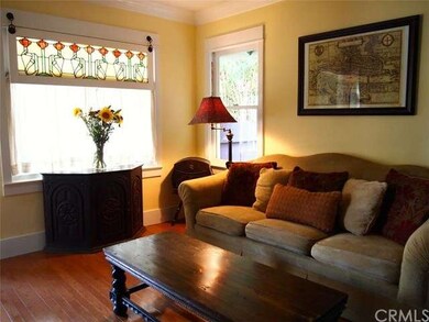 Living room, view of front window next to front do