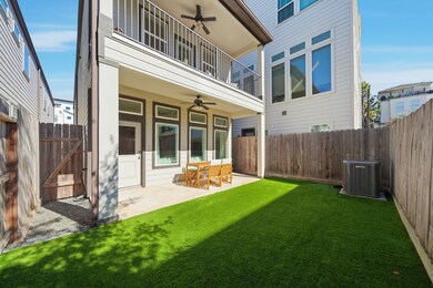 Backyard is zero maintenance with turf and a patio.