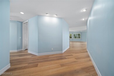 Corridor with light wood-type flooring