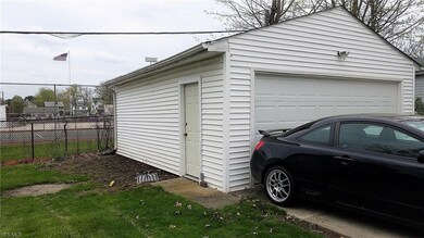 Newer two car garage to share and a spot for a fire pit or garden!