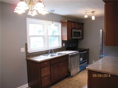 Kitchen. New cupboards, counters, flooring and lig