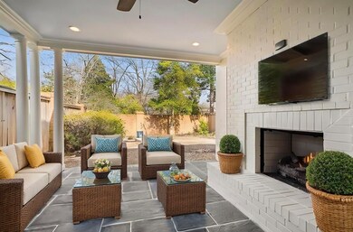 Exterior space with an outdoor brick fireplace and