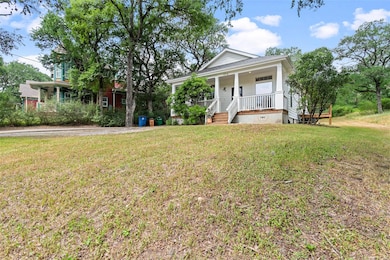 View of front of home featuring covered porch and