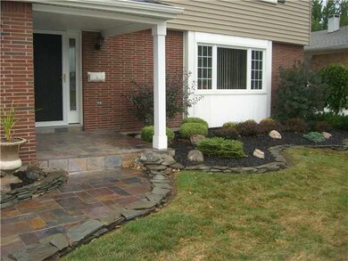 Exterior Front Custom Landscaping and Slate walkwa