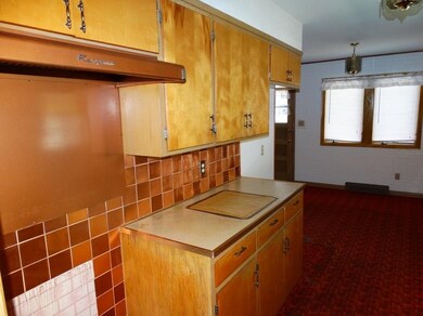 Kitchen looking toward large informal Dining area