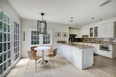 Spectacular natural light flows through the space. This breakfast room is situating for easy and causal dining.